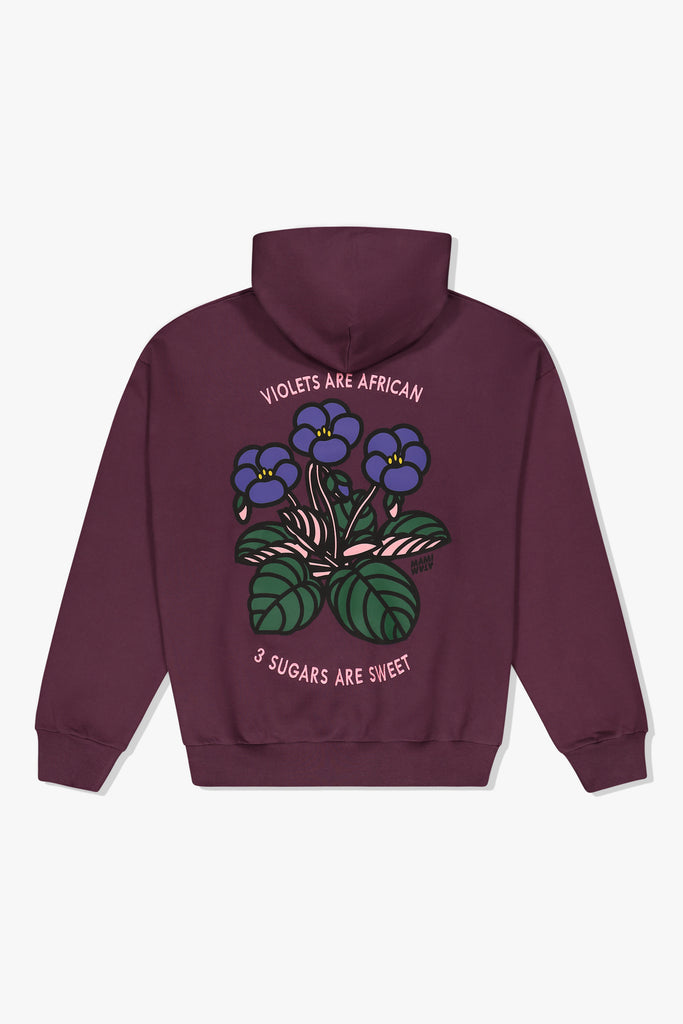 Violet Mami Wata hoody with “Violets are African. 3 sugars are sweet.” graphic.